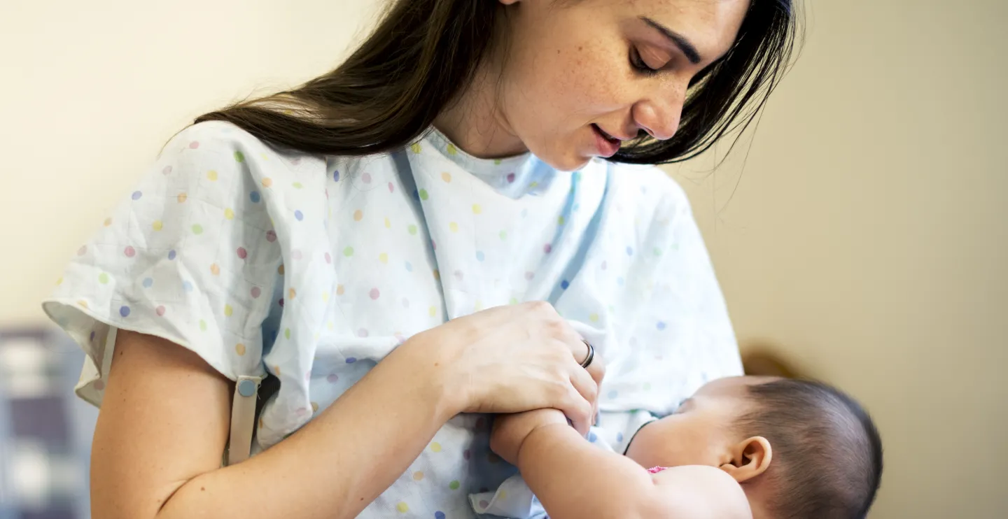 Woman breastfeeding her newborn, shutterstock_575749180