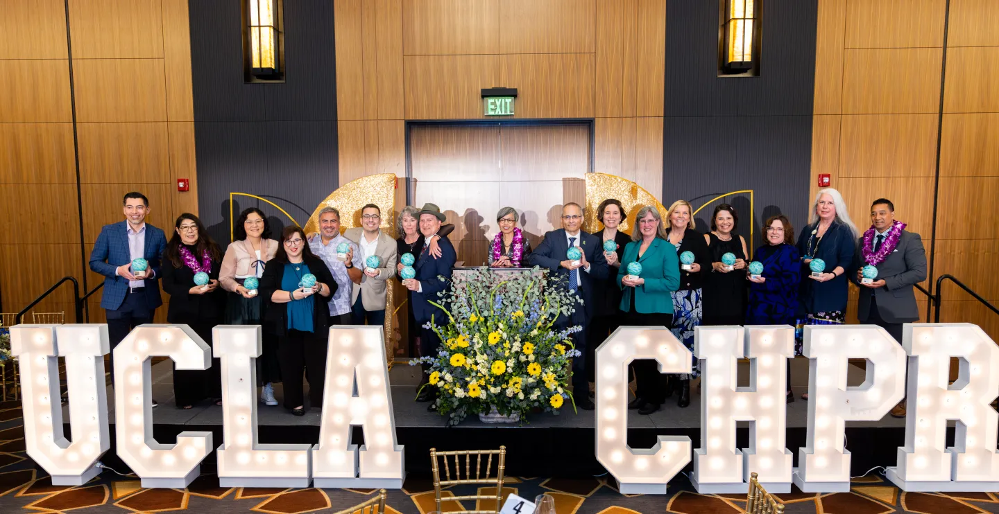 Honorees holding their awards at the UCLA Center for Health Policy Research's 30th anniversary gala. Dr. Efrain Talamantes, Sherry M. Hirota, Sunghee Lee, Shana Charles, Alex Ortega, Jeffrey Reynoso, Sue Holtby, Robert Otto Valdez, Ninez A. Ponce, Dr. Tomás Aragón, Maria-Elena De Trinidad Young, Dr. Linette T. Scott, Susan Demarois, Usha Lee Mcfarling, Louise McCarthy, Delight Satter, and Alex Sripipatana.