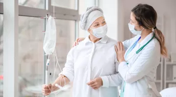 Doctor and woman undergoing chemical therapy course in clinic