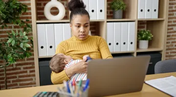 Woman breastfeeding while working